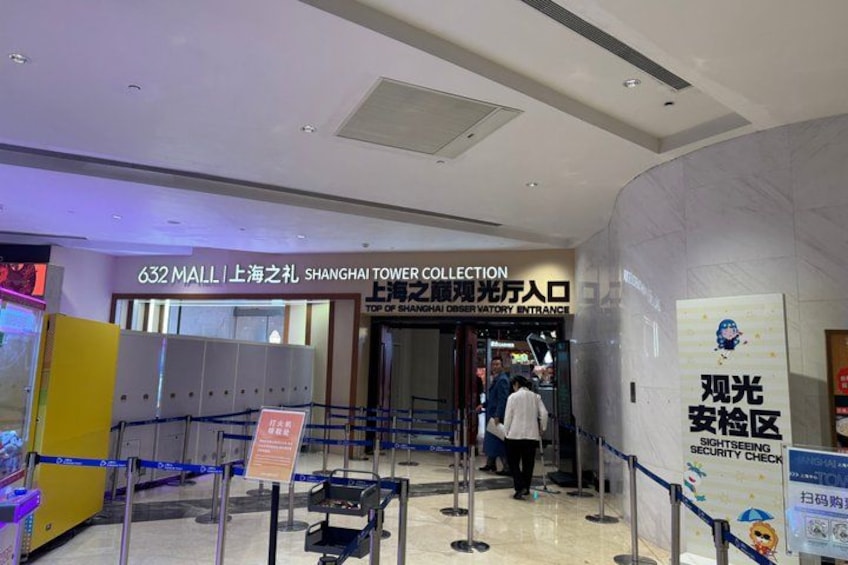 An indoor shopping area with a sign for the Shanghai Tower Collection at 632 Mall. 3