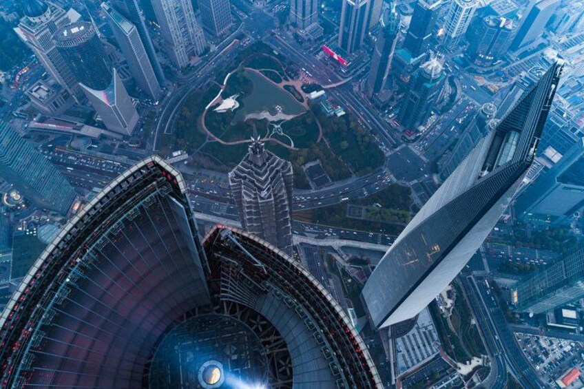 A cityscape with a prominent curved skyscraper and a tall, pointed skyscraper. 5