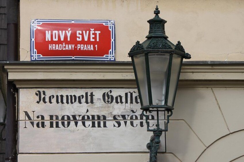 A street sign with 'Nový Svět' and a street name 'Revolta-Galla' in Prague. 4