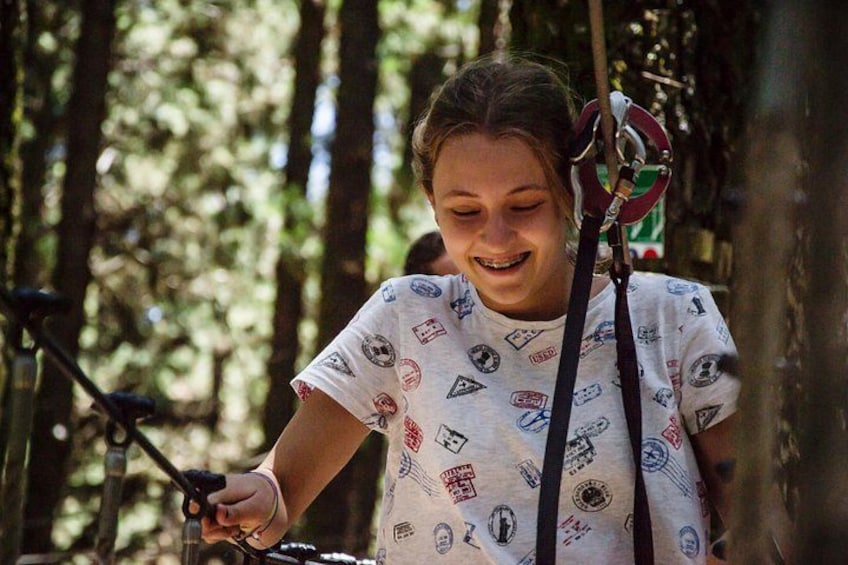 A person riding a bicycle in a wooded area. 4