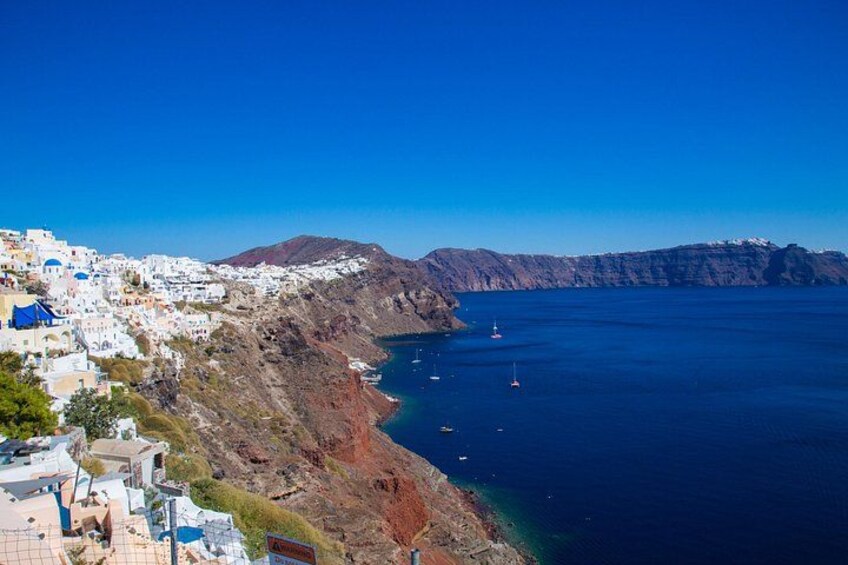 Village of Oia: The majestic famous town with the most unapparelled beauty and astonishing views, whitewashed houses carved into the rugged clifftops that overlook the caldera. 3