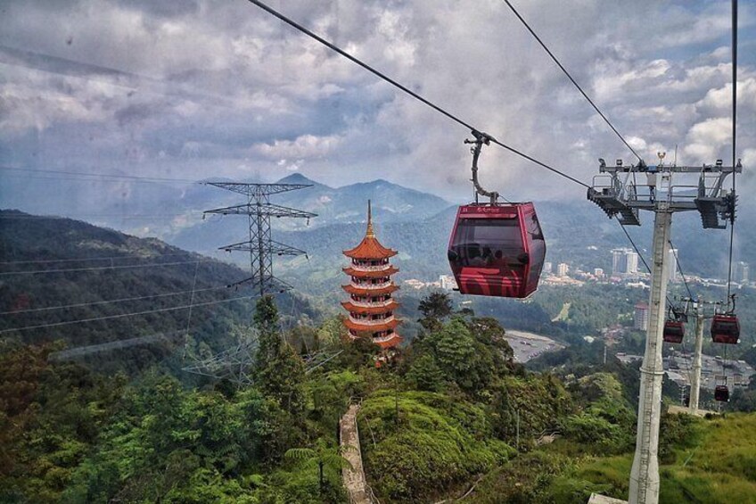 A cable car system, a pagoda, and a mountainous landscape. 1