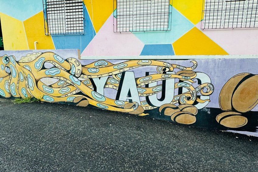 A colorful mural with the word 'YALE' and a stylized octopus on a wall. 3