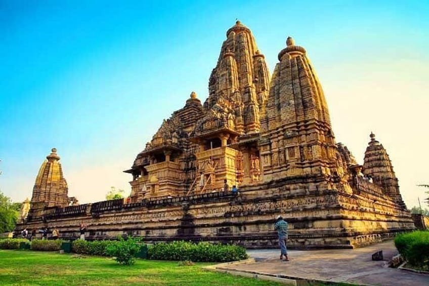 A large, intricately carved temple with multiple spires and a central tower. 1