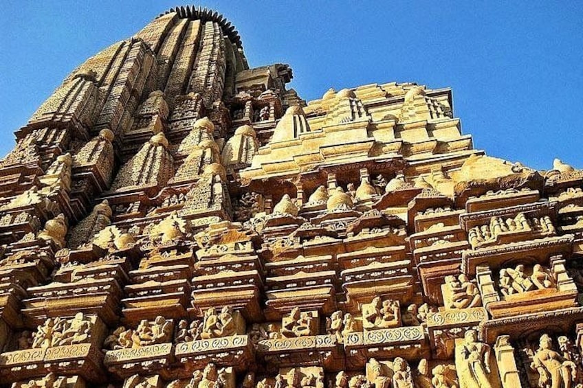 A detailed temple facade with intricate carvings and sculptures. 4