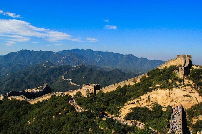 The Great Wall of China, mountainous terrain, and a clear sky. 4