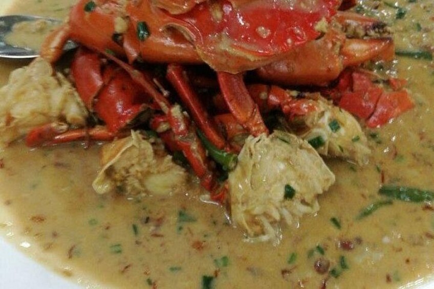 A dish with crab and chicken in a creamy sauce. 3