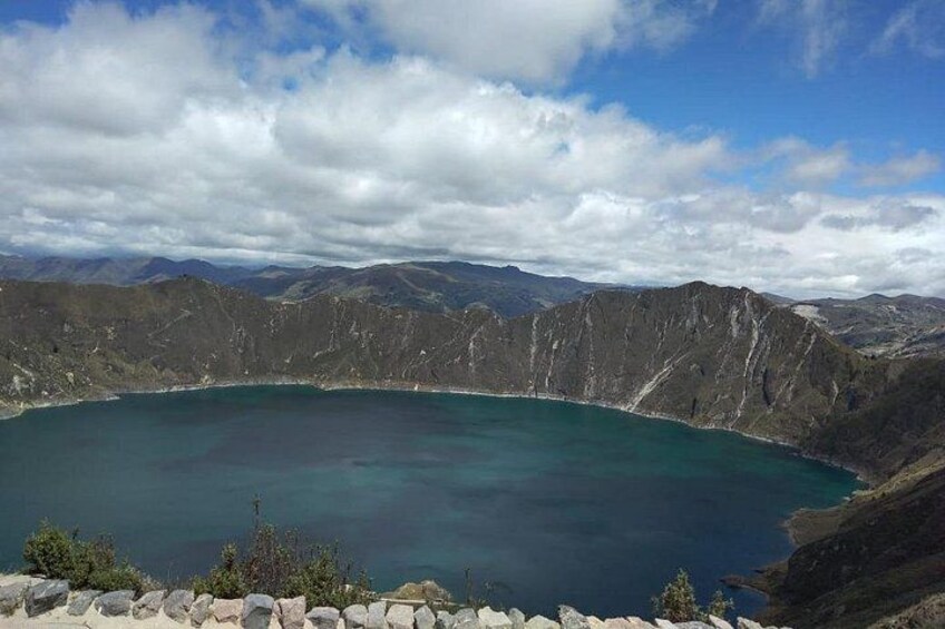 A large crater lake surrounded by mountains. 5