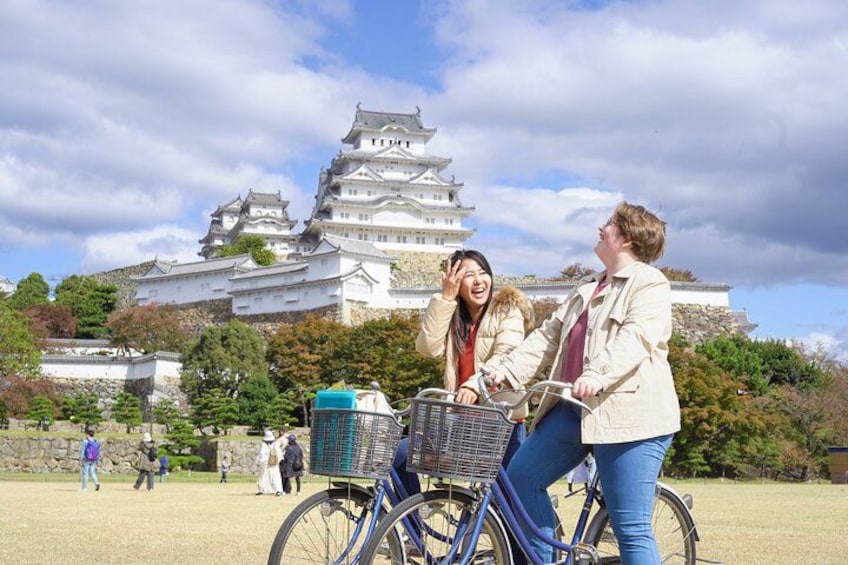 A castle, a bicycle, and people. 2