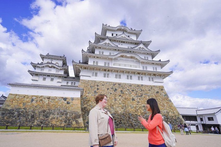 A traditional Japanese castle with multiple tiers and a stone base. 1