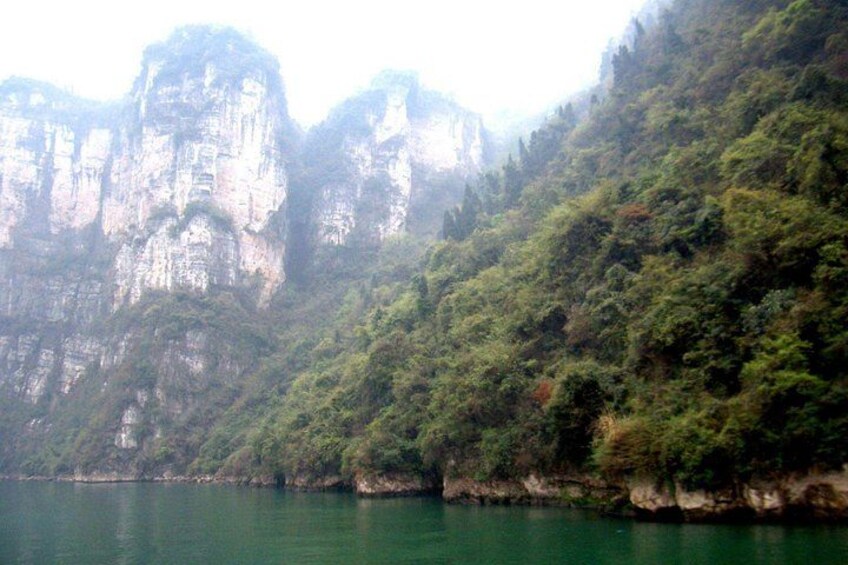 A mountainous landscape with a body of water. 2