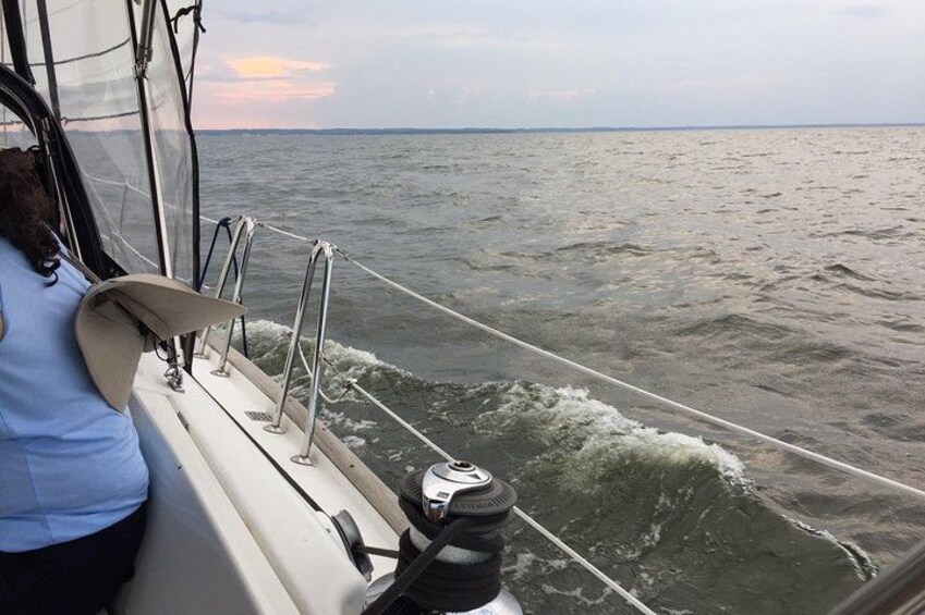 A person on a boat with a view of the ocean. 1