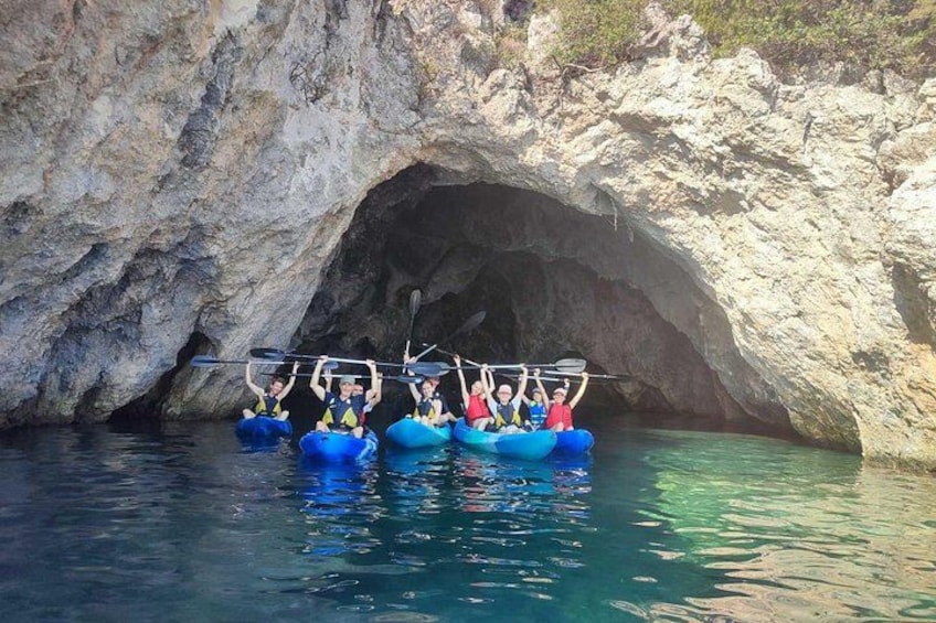A group of people kayaking in a cave. 1