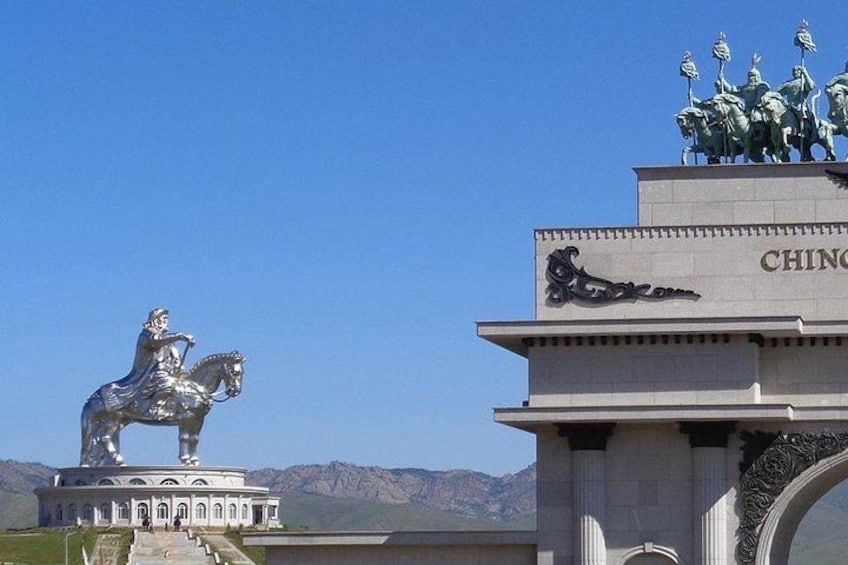 A statue of a figure on horseback, a building with the inscription 'CHINA,' and a mountainous landscape in the background. 4