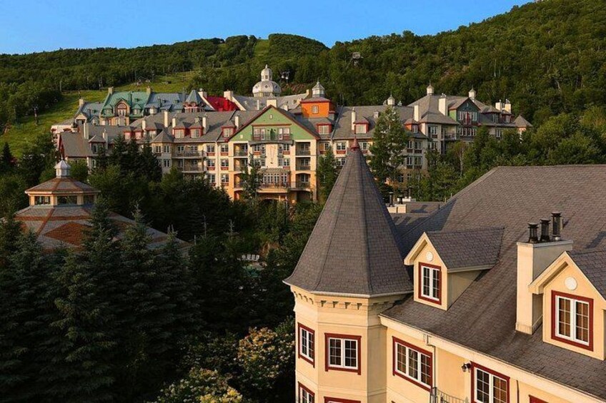 A resort with multiple buildings, including a prominent tower and a domed structure. 3
