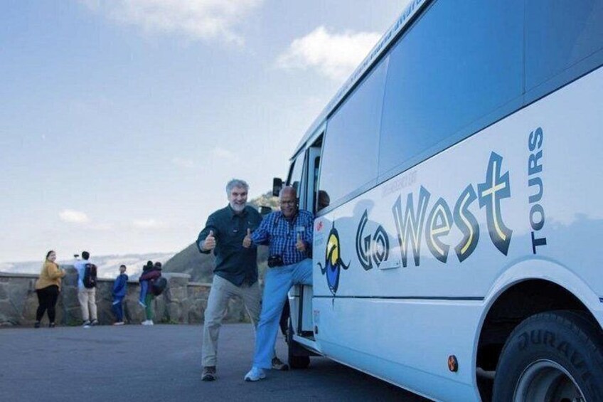 A tour bus with 'Go West Tours' written on its side. 2