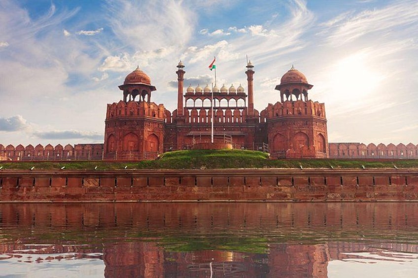 A large, historic building with domes and minarets, reflecting in a body of water. 3