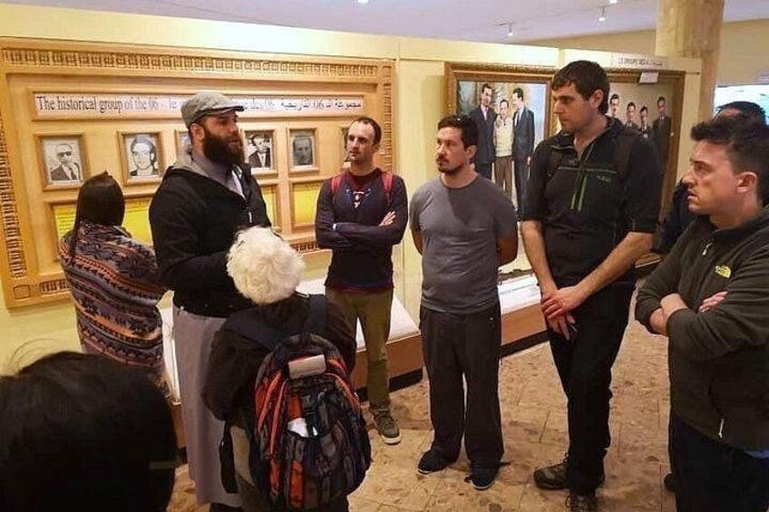 A group of people in a museum with historical exhibits. 4