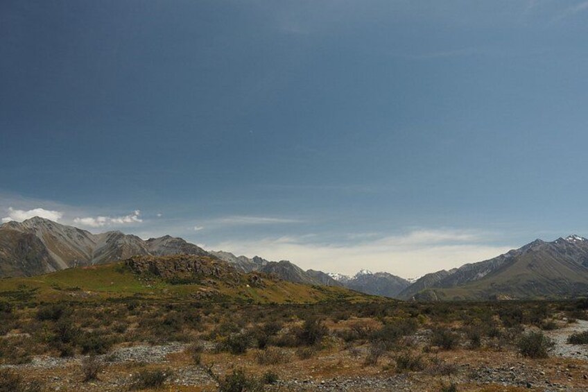 A mountainous landscape with a clear sky. 2