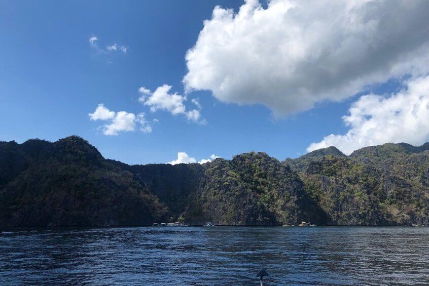 A body of water with mountains in the background. 2
