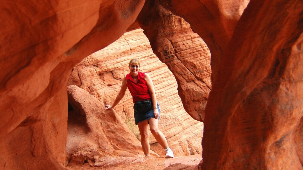 Happy woman posing for a quick photo within the rock formations in the Valley of Fire