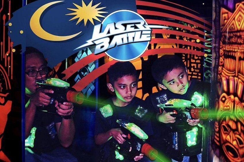 A laser tag arena with neon signage and a crescent moon graphic. 4