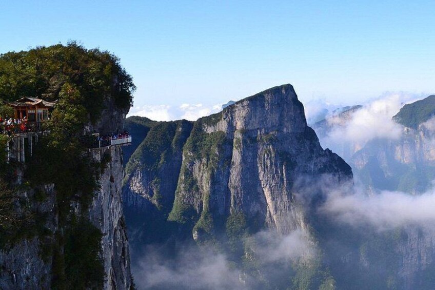 A mountain with a viewing platform and a steep cliff. 2