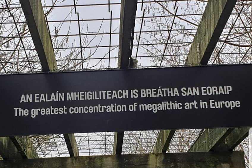 A sign with text about an art exhibition. 1