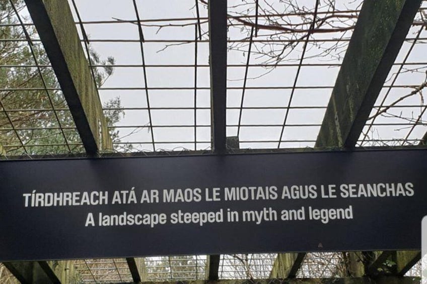 A sign with text in a foreign language and English translation. 2