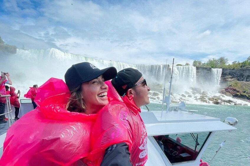 A boat with a waterfall in the background. 1