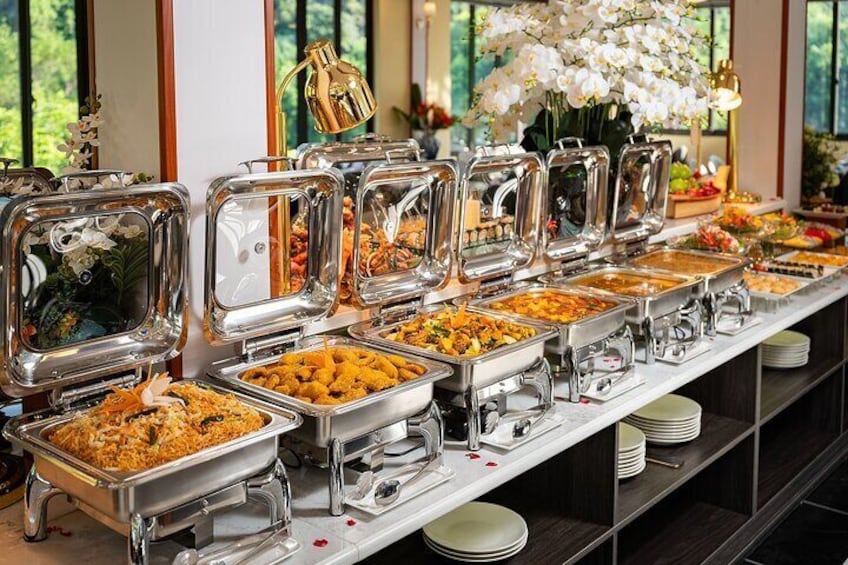 A buffet with various food items in metal containers. 2
