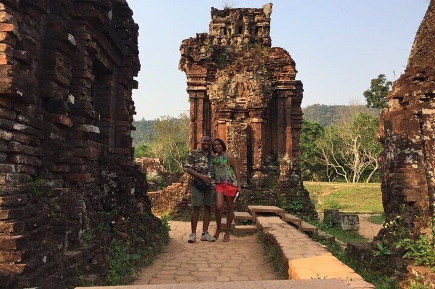A historical site with ancient brick structures and a pathway. 4