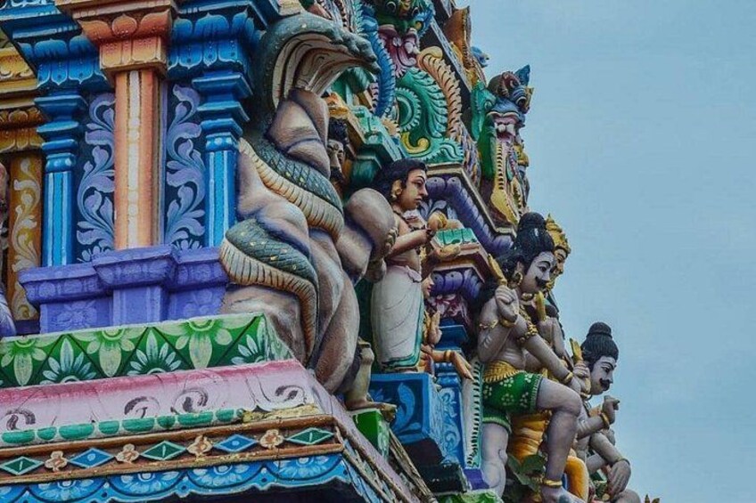 A temple with colorful carvings and statues. 4