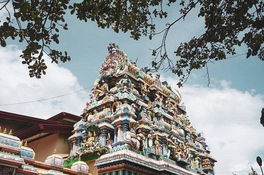 A multi-tiered temple with intricate carvings and statues. 3