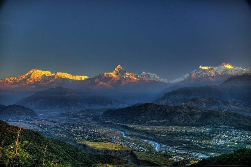 A mountainous landscape with a valley and a river. 1