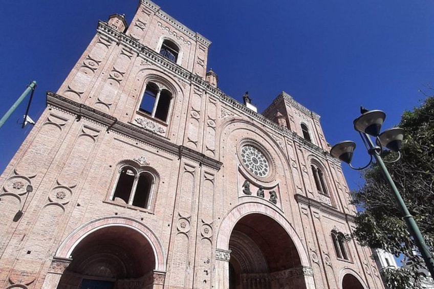 A large, historic church with a prominent bell tower and arched windows. 2