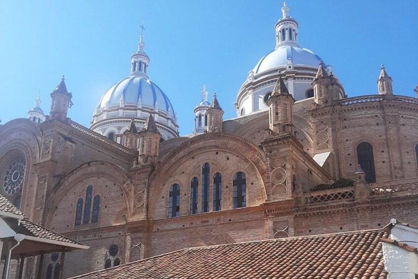 A large, historic church with multiple domes and arched windows. 3
