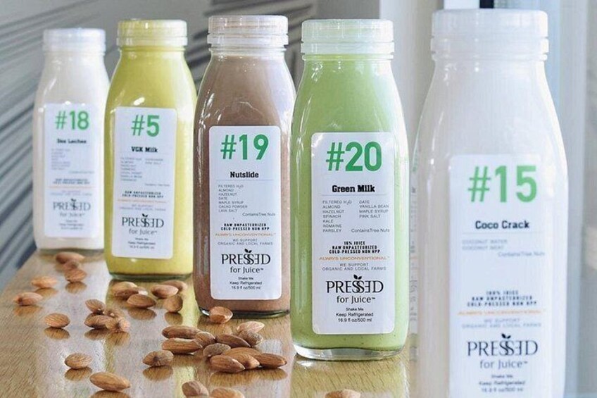 Five bottles of juice with labels indicating their names and numbers. 2