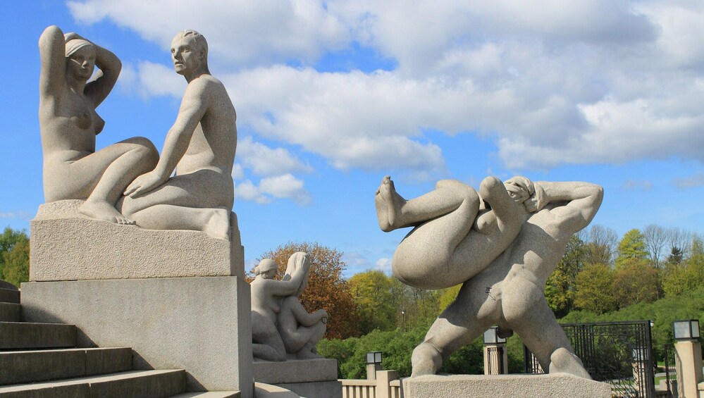 A sculpture garden with abstract human figures in various poses. 3