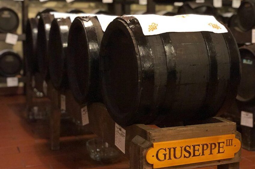 Barrels labeled 'Giuseppe III' in a storage area. 5