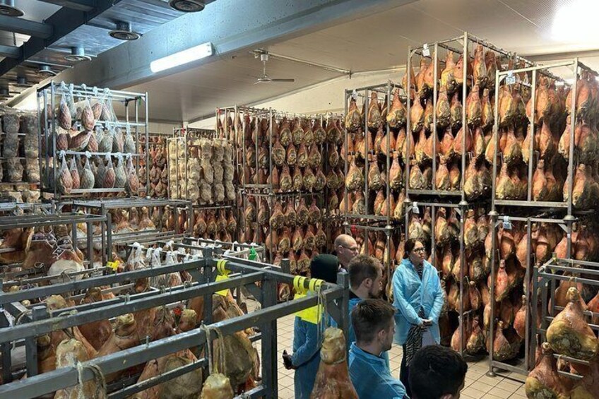 A large industrial facility with numerous hanging pig heads, likely for processing or storage. 5
