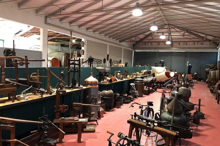 A warehouse filled with antique machinery and tools. 4