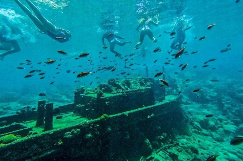 Underwater ruins with divers and fish. 1