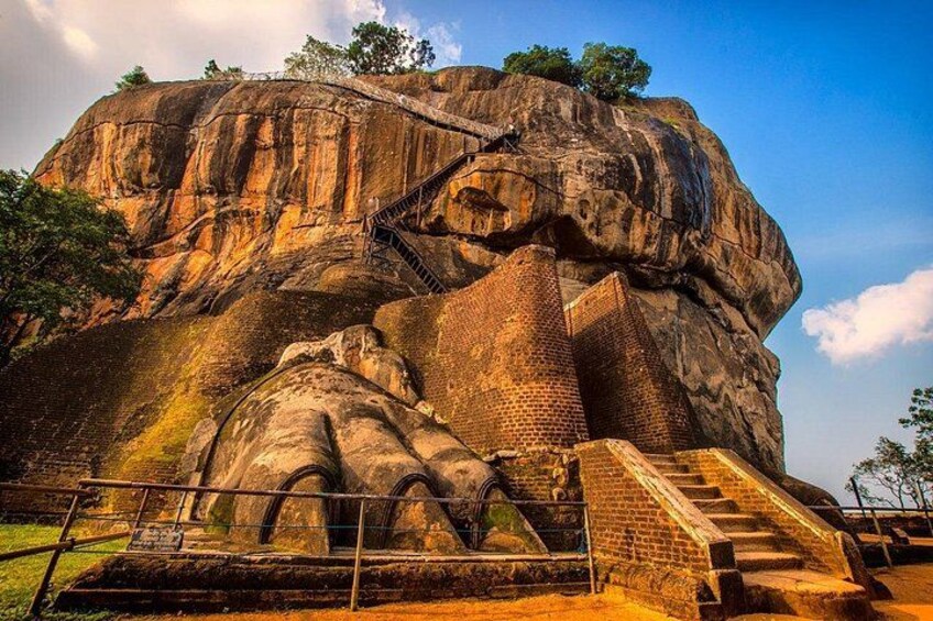 A large rock formation with a staircase leading up to it. 2