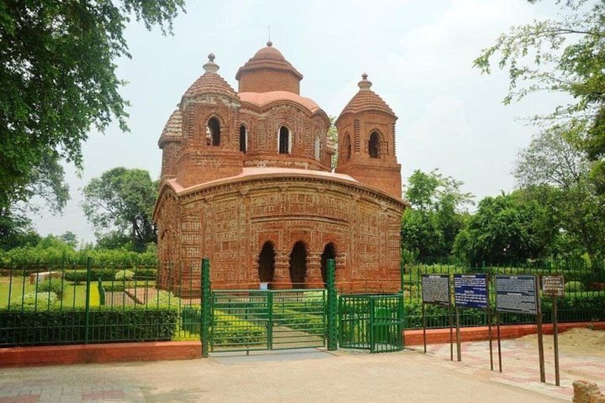 A historic building with domed towers and intricate brickwork. 2