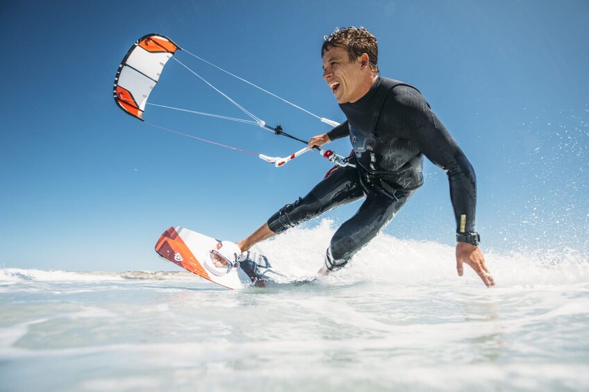 A person windsurfing on the water. 1