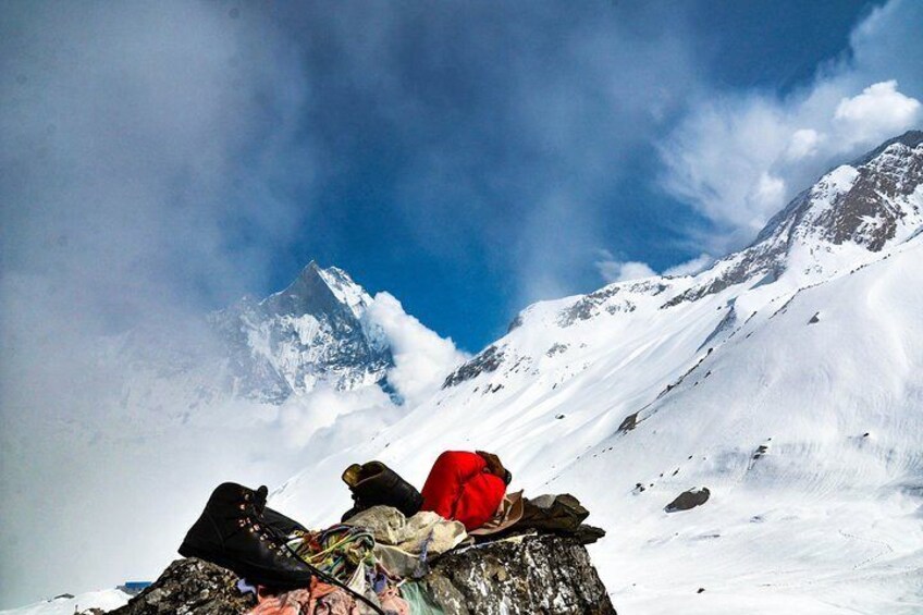 Trekker taking a sun bath at Annapurna Base Camp 4