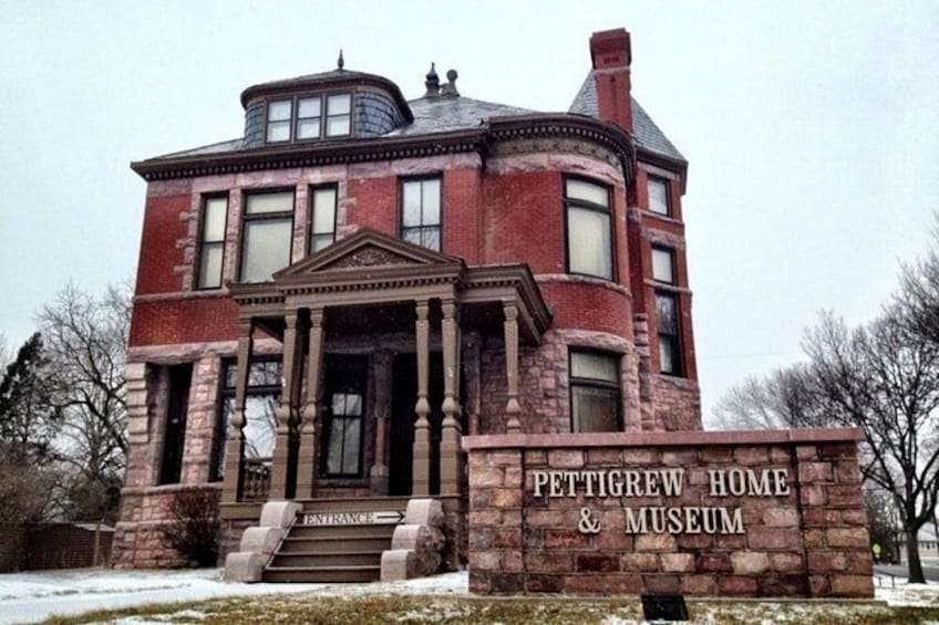 Pettigrew Home & Museum, a large brick building with a prominent entrance and columns. 4