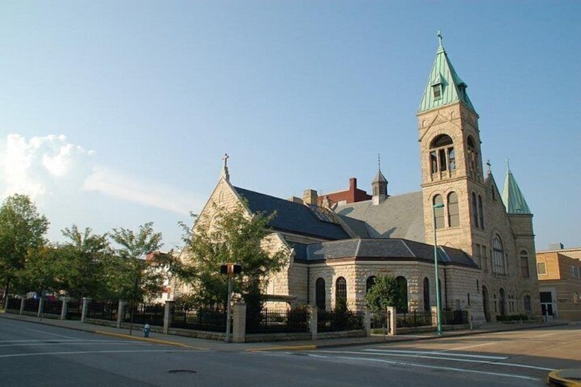 A historic church with a prominent tower and steeple. 5
