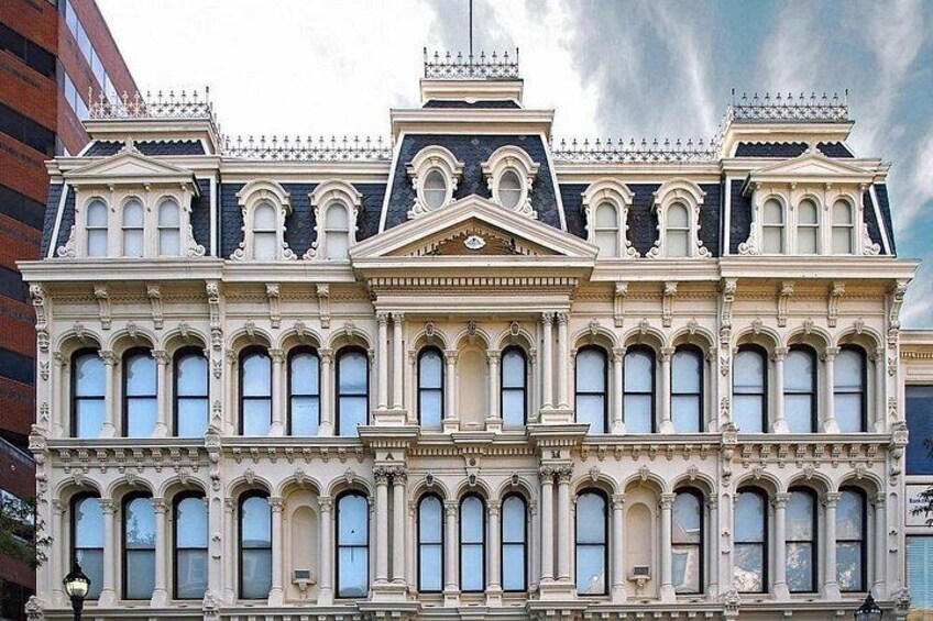 A historic building with ornate architectural details, including multiple windows and decorative elements. 4